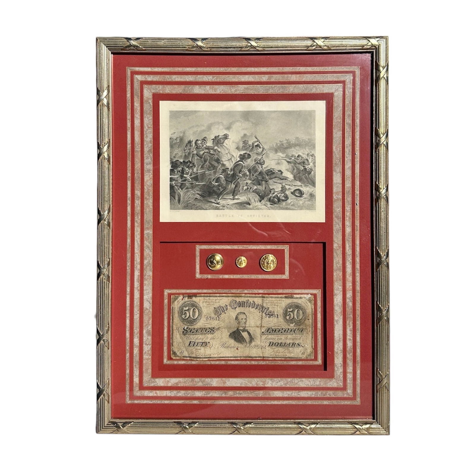 Framed Assortment of Civil War Memorabilia: Framed Confederate States of America (CSA) currency from the Civil War era, featuring a $50 banknote, Confederate States of America and Eagle buttons in gold tone metal.