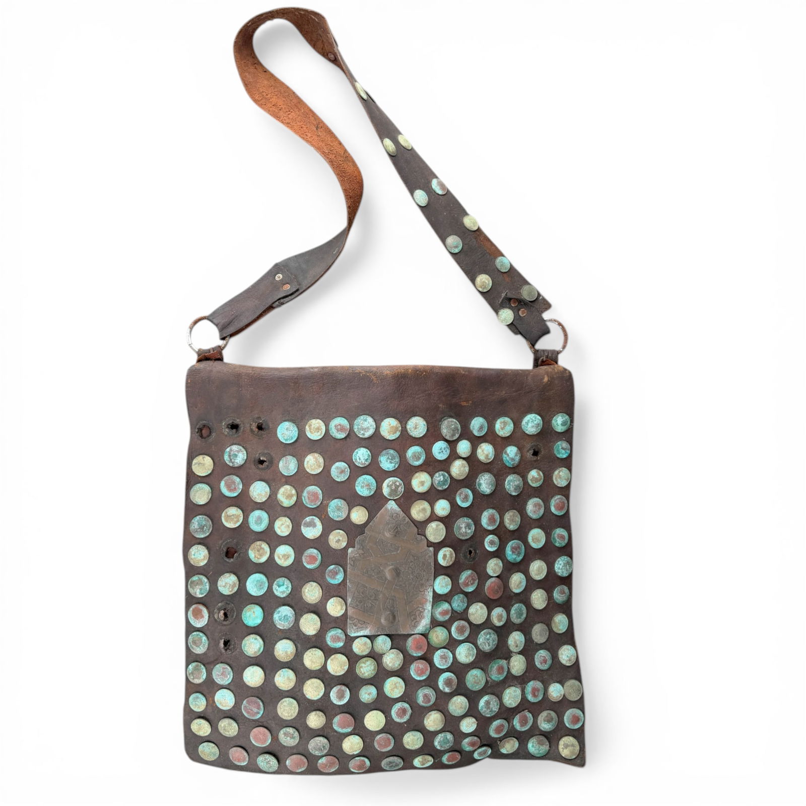 Vintage Moroccan Water Sellers Bag: Vintage Moroccan water sellers or water carrying bag. made of phenomenal thick leather, Moroccan coins and a brass plate. Stitched with leather. measures 18" X 18" with a total length of 38", 19"