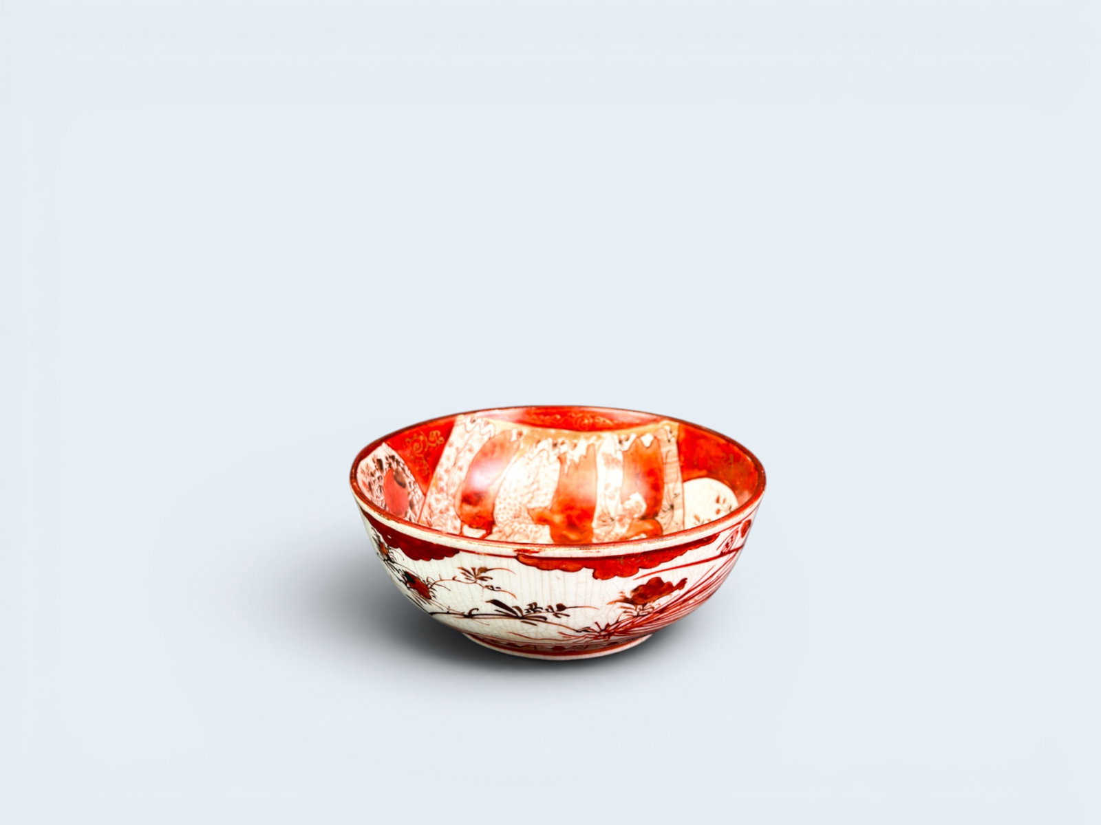 JAPANESE KUTANI BOWL: Antique c. 19th century, Japanese Kutani Satsuma bowl figural interior and botanical exterior. 2 1/4" H X 5 1/2" Diameter