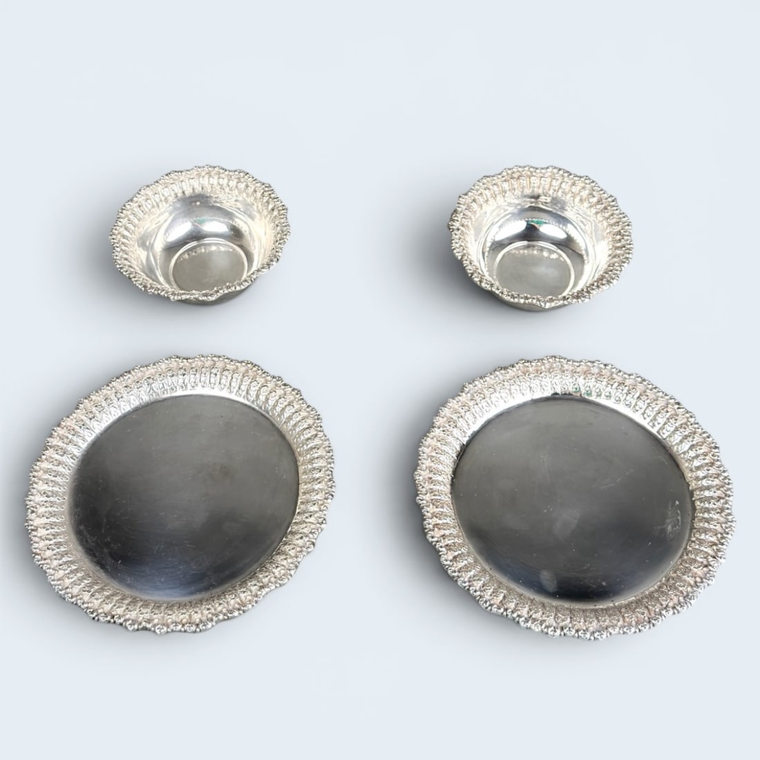 (4) pcs ITALIAN REPUSSE: 2 bowls, 2 plates. Stamped italy 925 2" h x 5" w 3/8" h x 7 1/2" diam
