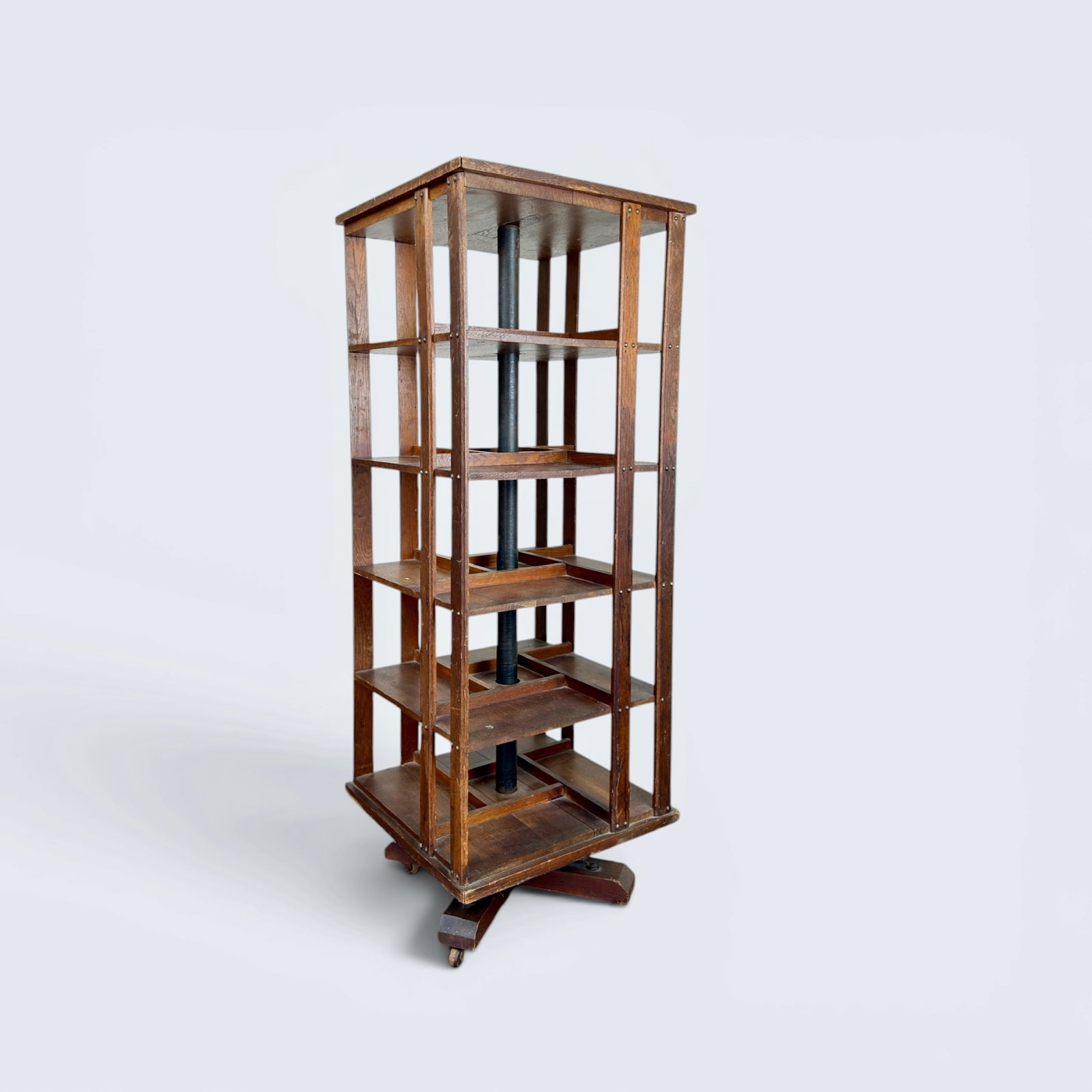 c.1890 DANNER OAK AND IRON REVOLVING BOOKCASE: Antique oak and cast iron Danner Manufacturing,Revolving Bookcase. Made in the Ohio, North America. 51 3/4" h, 18 3/4" w 18 7/8" d