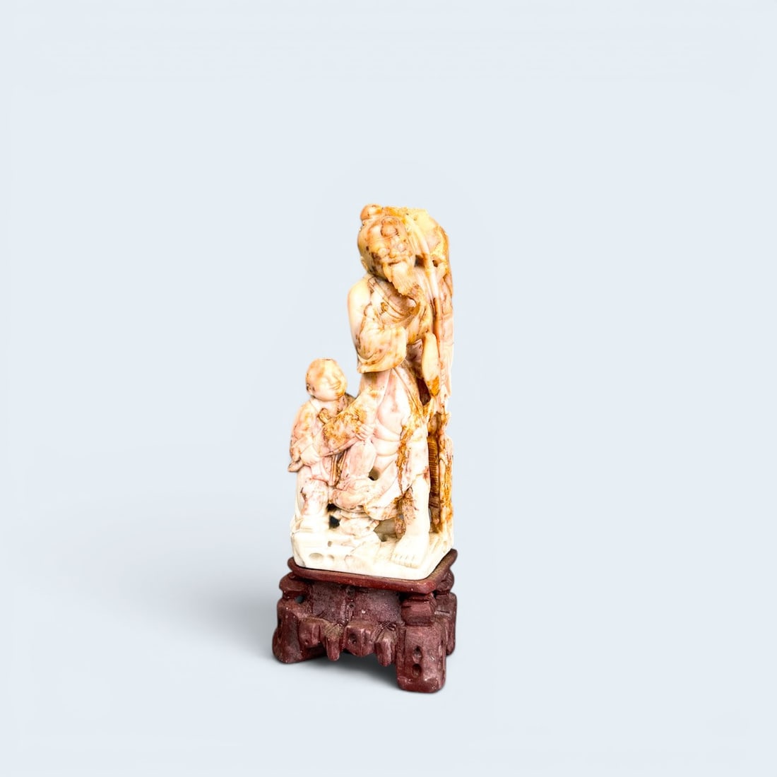 CHINESE SHOULAO FIGURAL CARVING on ROCKWORK PEDESTAL: Antique Carved shoushan stone of Shoulao figure, with disciple. Fixed to carved stone pedestal base 7" h X 3" w X 1 3/4" d
