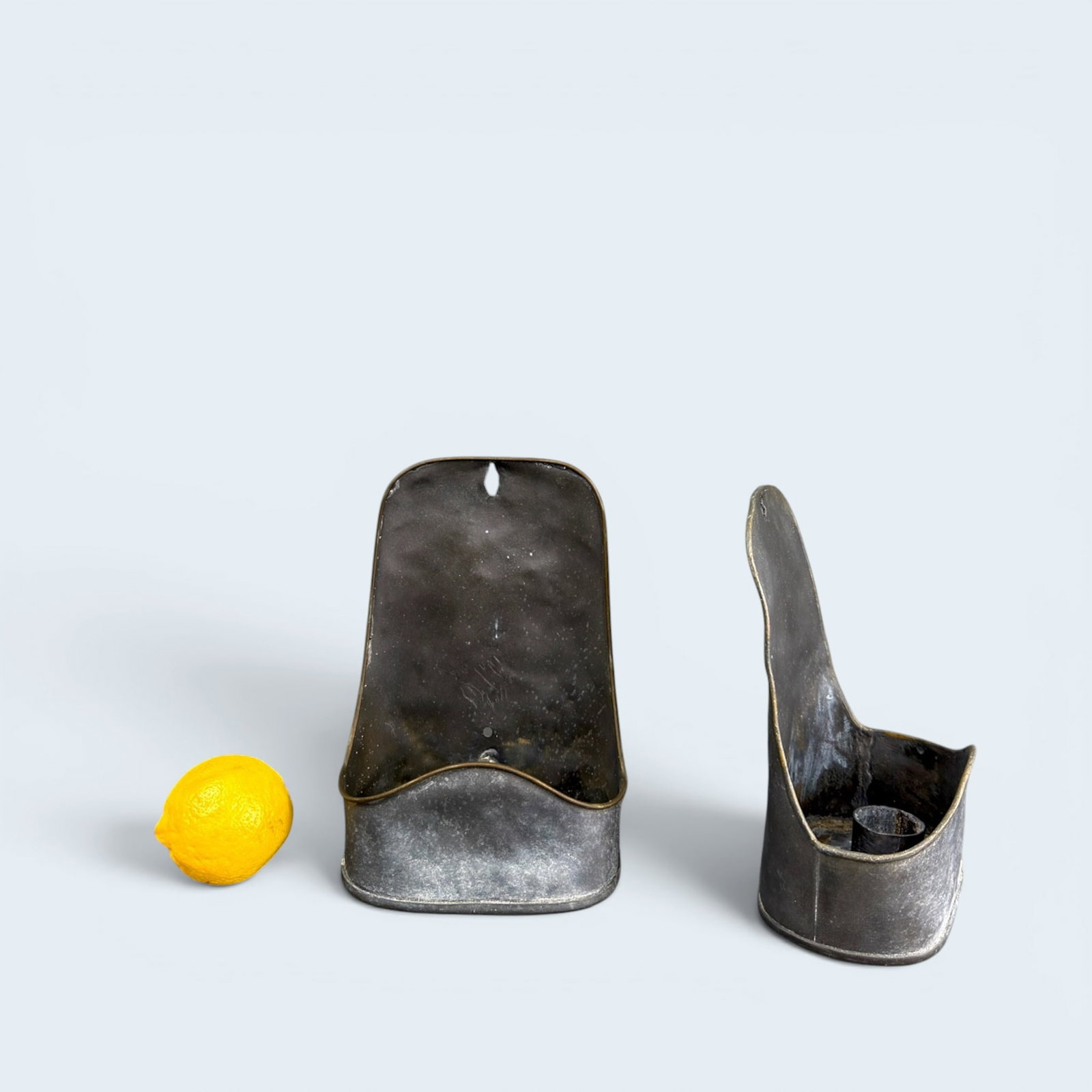 ANTIQUE LEADED WALL CANDLE HOLDERS: Soft and pliable metal with one candle holder in each pocket. hole at top for nailing to a wall.