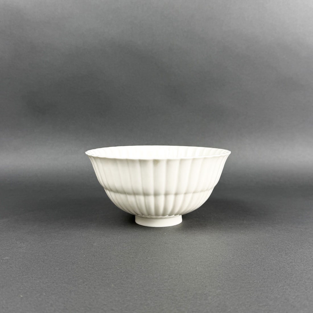 ROYAL COPENHAGEN BLANC DE CHINE BOWL: Elegant fluted blanc de chine white porcelain bowl by Royal Copenhagen marked 3717 on bottom.