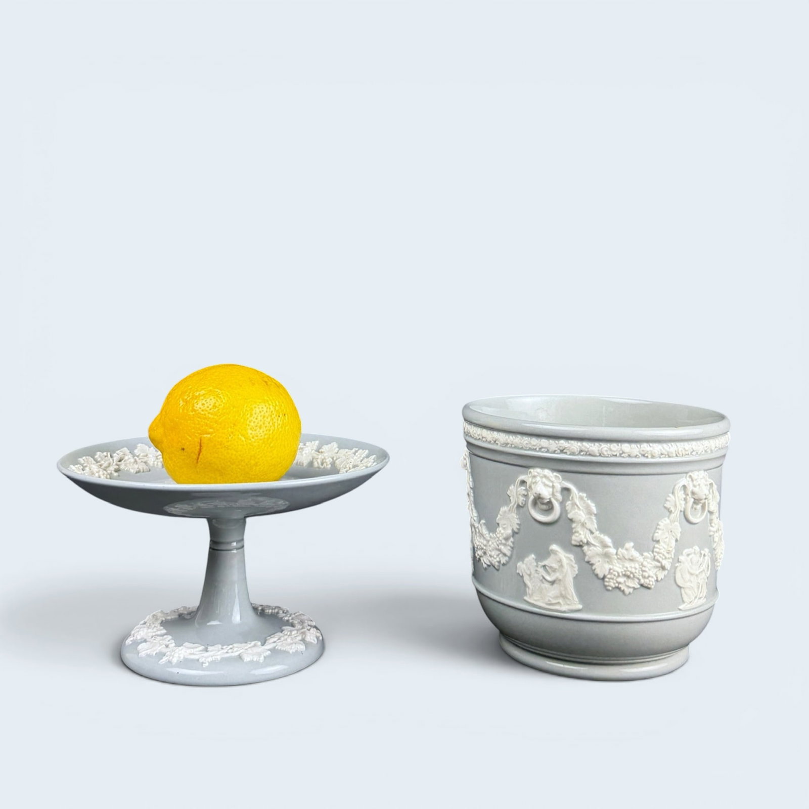 WEDGWOOD of ETRURIA & BARLASTON: Wedgwood of Etruria & Barlaston embossed queensware pedestal dish and planter in light grey with white relief. pedestal dish measures planter measures