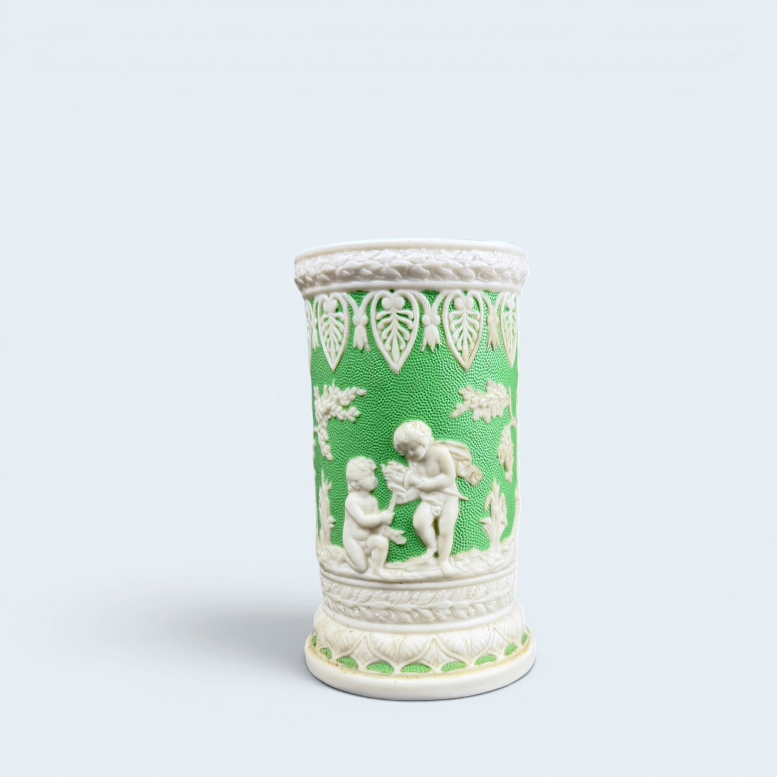 DALE HALL POTTERY LONGPORT RELIEF CUP: Antique bisque porcelain jasperware cup in lime green and white relief, by T.J.& J. Mayers Dale Hall Pottery Longport. Measures