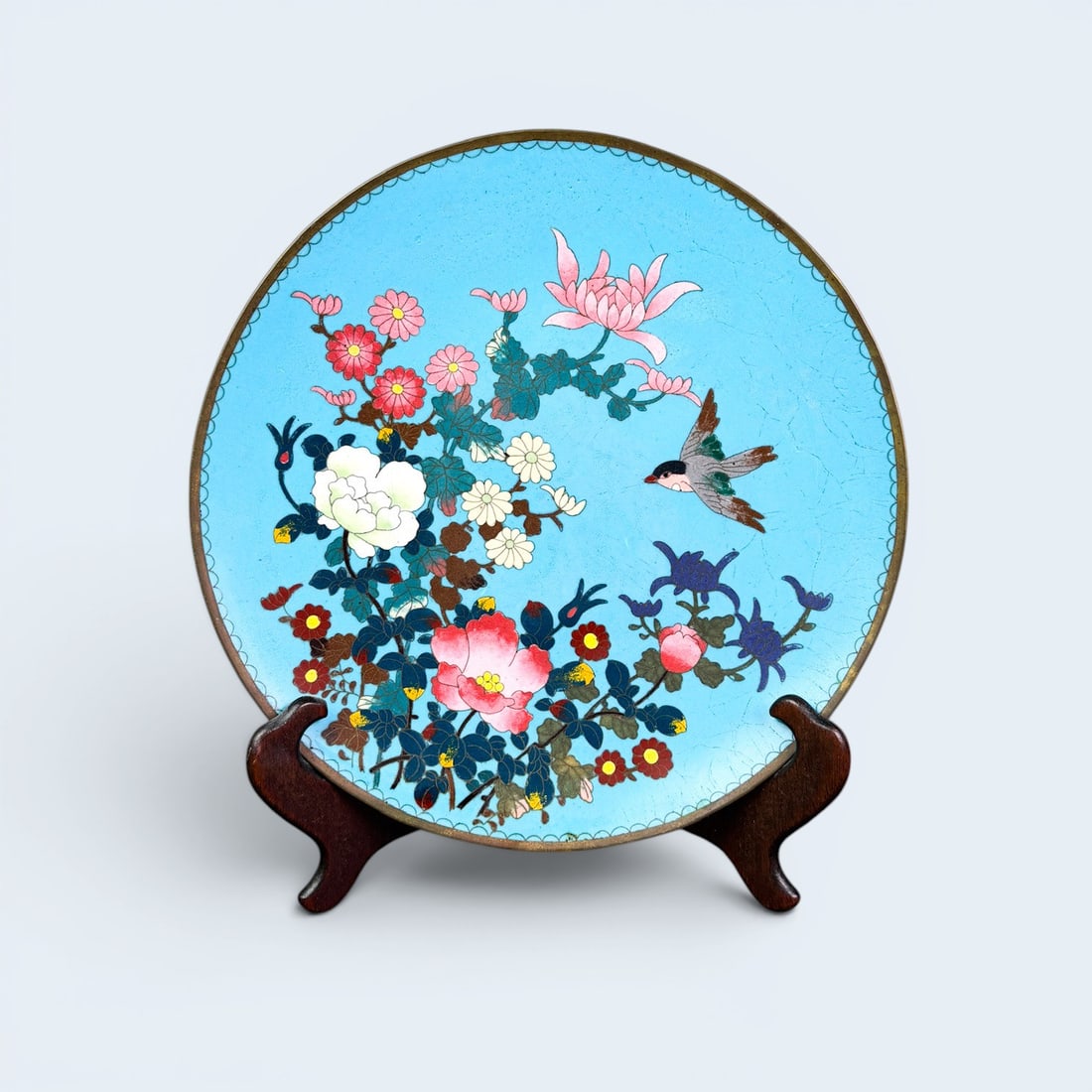 19TH C. MEIJI PERIOD CLOISONNE AND ENAMEL PLATE: Antique Japanese bronze or brass cloisonne and enamel plate with flora and bird motif. Measures approx 11 3/4" dia