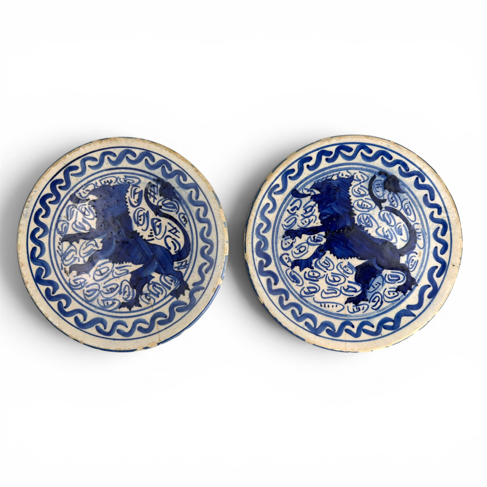 EARLY PAIR of SPANISH TIN-GLAZED TALAVERA PLATES: Each depicting a lion rampant symbol for the Kingdom of Leon. 8.5 inches