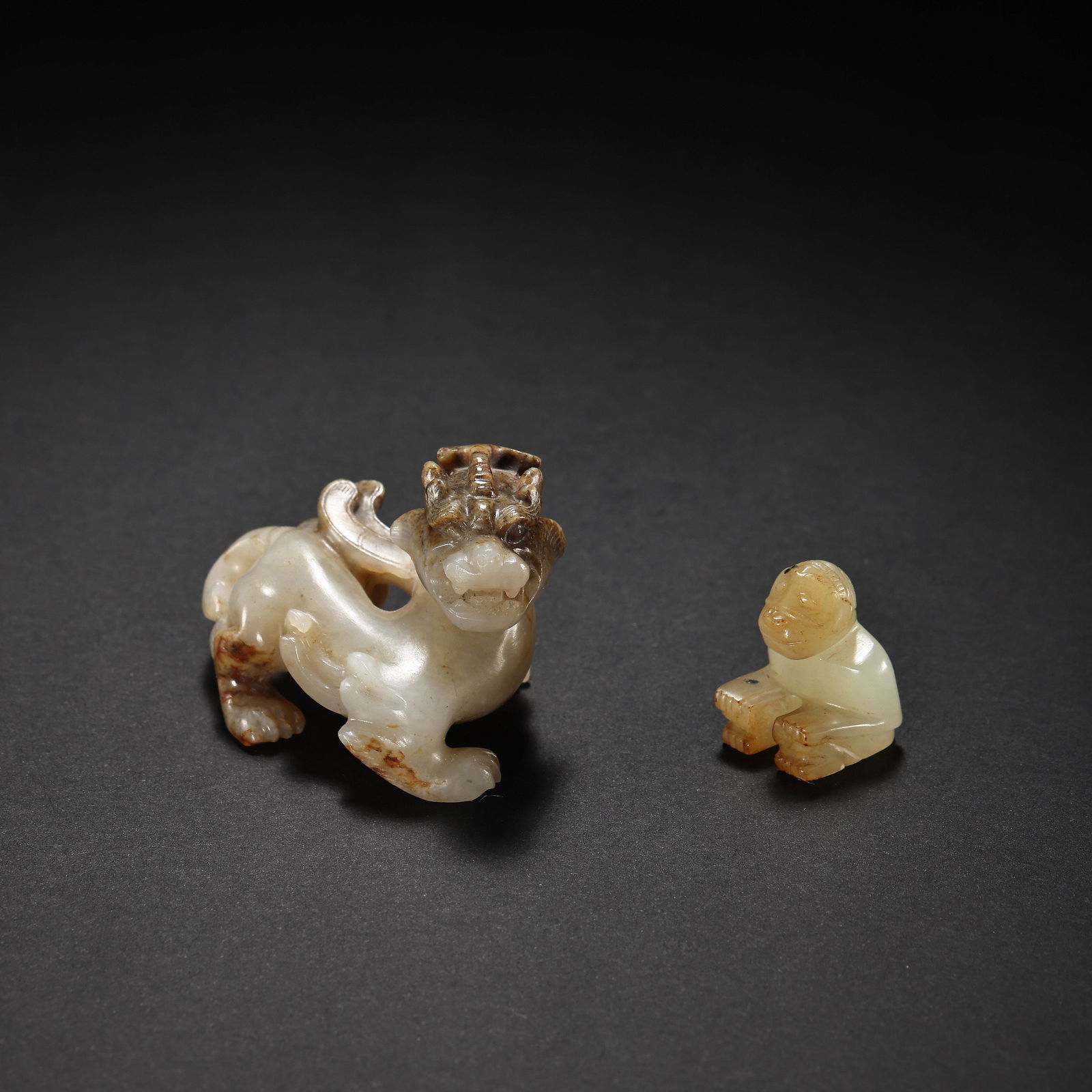 A GROUP OF CHINESE HAN DYNASTY HETIAN JADE ORNAMENTS (1 of 16)