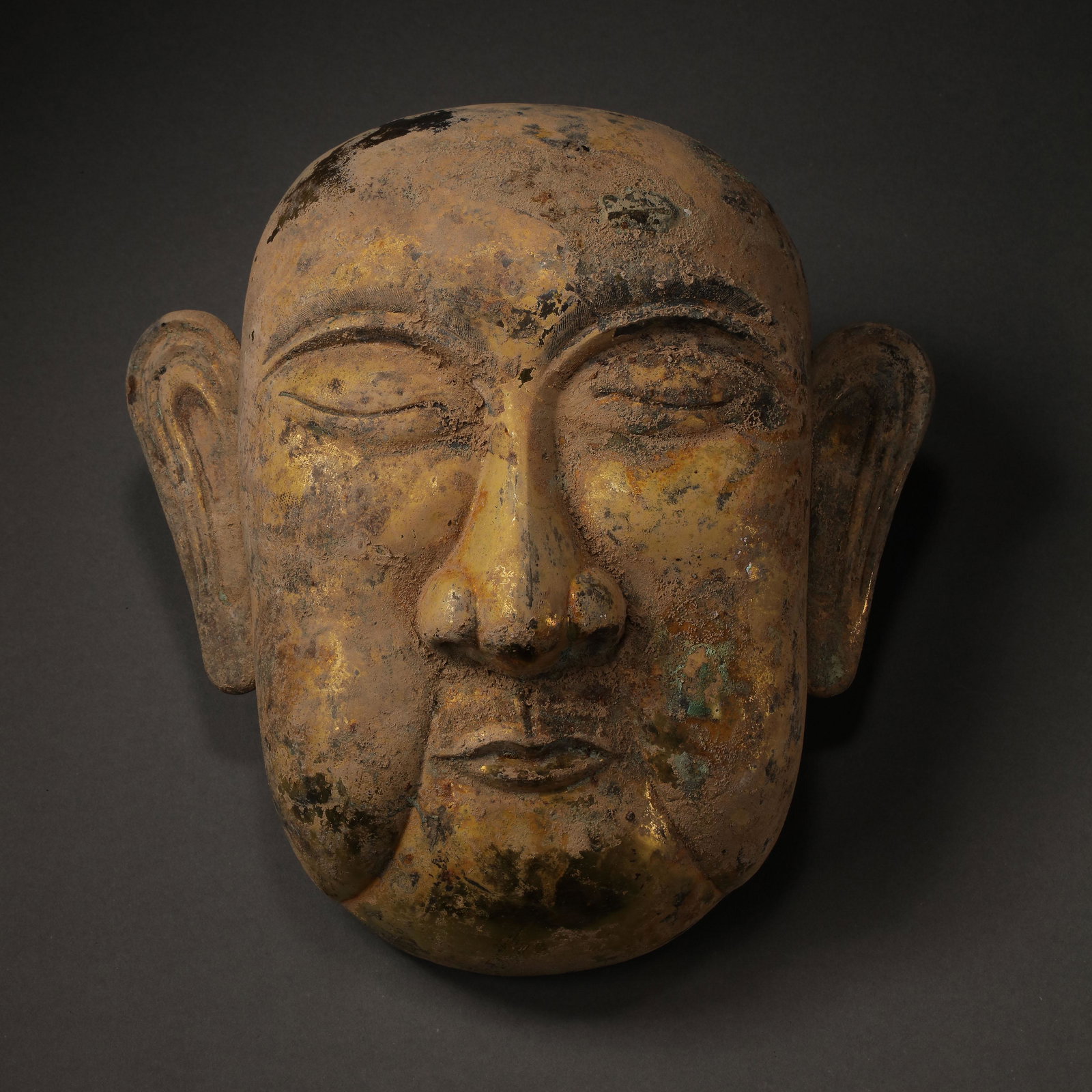 CHINESE LIAO DYNASTY GILT BRONZE MASK: CHINESE LIAO DYNASTY GILT BRONZE MASK L. 25 cm. W. 23.5 cm. Weight 391 gram.