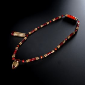 CHINESE LIAO DYNASTY AGATE-COVERED GOLD COLLAR
