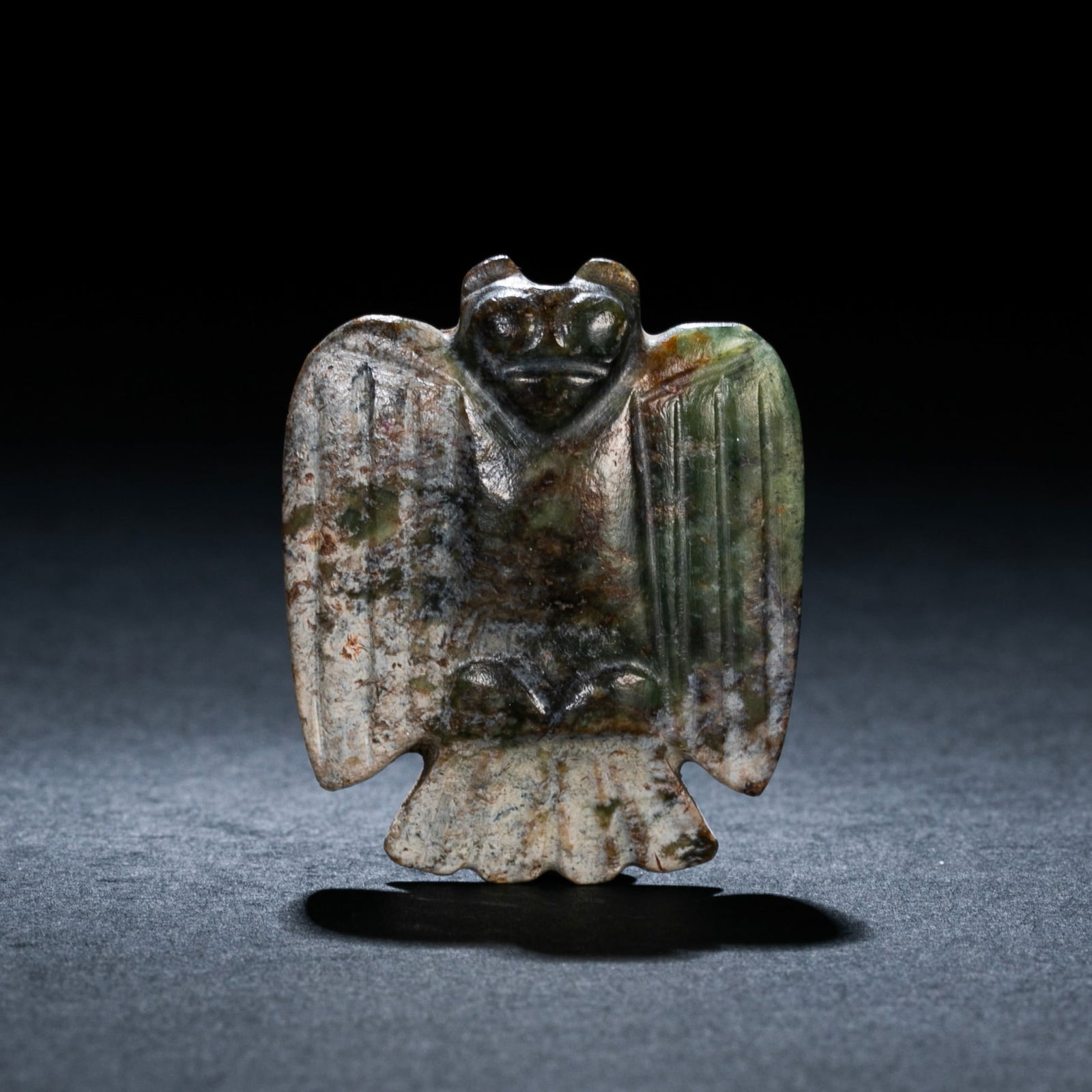 JADE OWL OF HONGSHAN CULTURE, CHINA: JADE OWL OF HONGSHAN CULTURE, CHINA;H. 4 cm. W. 3.2 cm. Weight 13.5 gram.