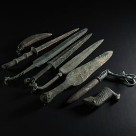 A GROUP OF ERDOS CULTURAL SWORD ORNAMENTS