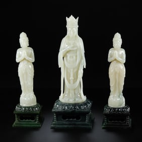 A GROUP OF CHINESE QING DYNASTY HOTAN WHITE JADE INLAID IN HOTAN JASPER BUDDHA STANDING STATUES