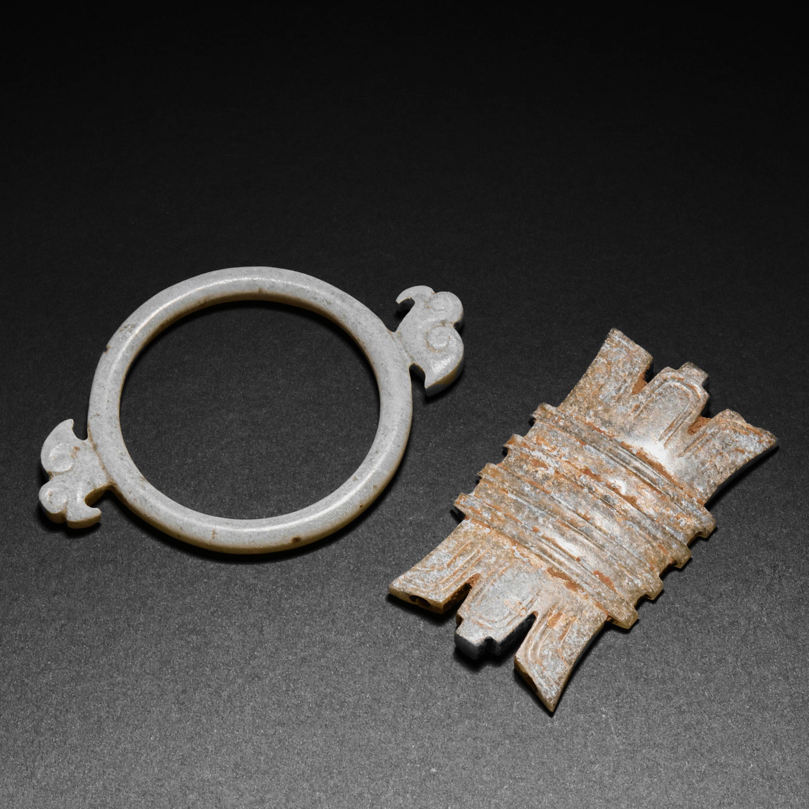 A GROUP OF CHINESE JADE ARTIFACTS FROM THE HAN DYNASTY: A GROUP OF CHINESE JADE ARTIFACTS FROM THE HAN DYNASTY; L. 4.5 cm. W. 2.5 cm. L. 5.5 cm. W. 3.5 cm. Weight 13 gram.