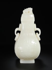 Chinese Qing Dynasty Hetian white jade animal face pattern double ring ear cover bottle