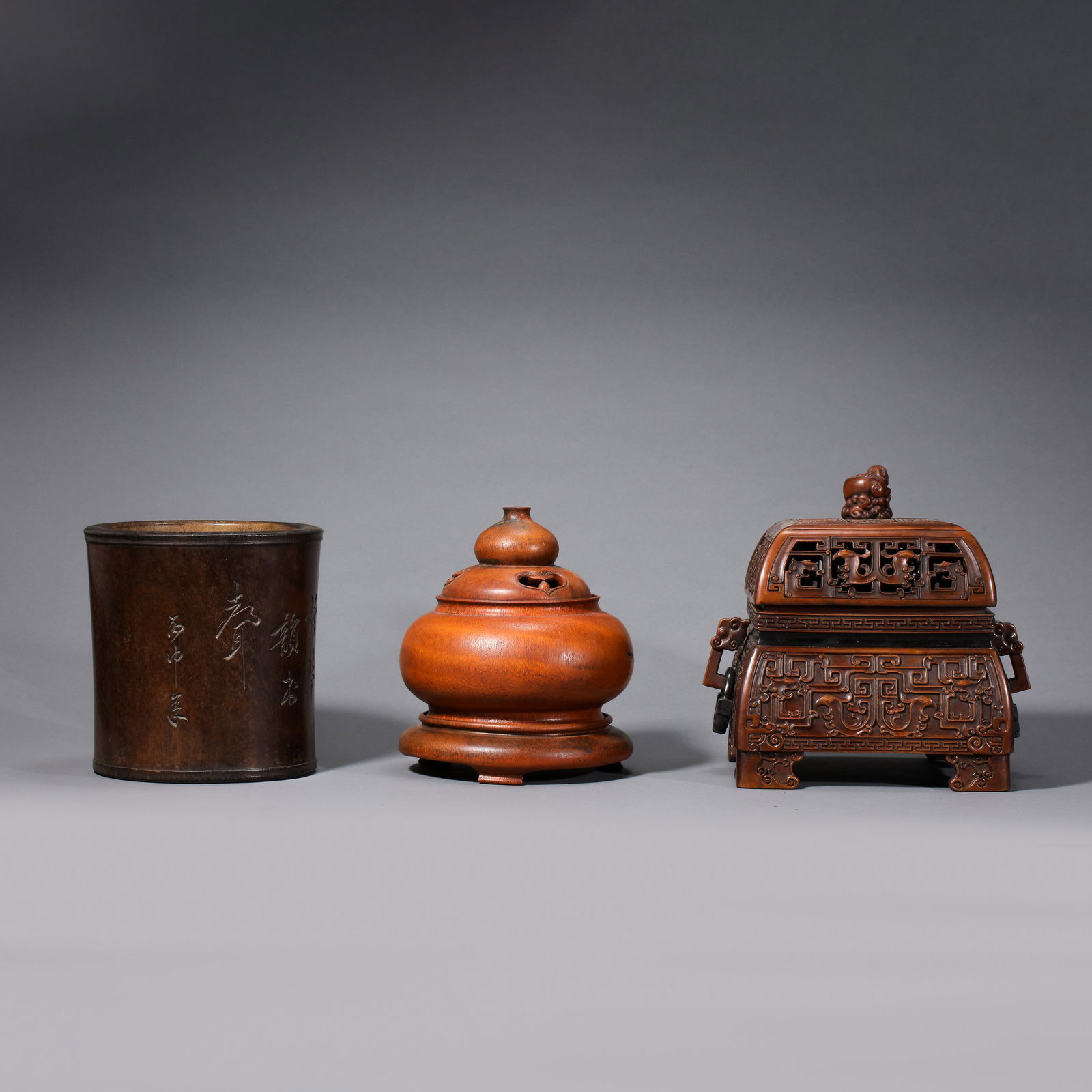 A set of Chinese Qing Dynasty Huanghuali wood incense burners and pen holders (1 of 14)