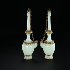 A pair of Chinese Liao Dynasty Hetian jade gilded vases