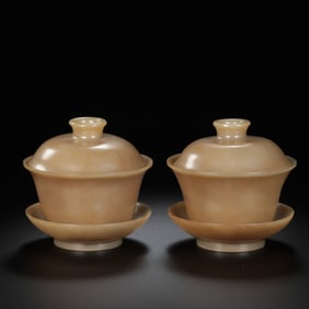 A pair of Chinese Han Dynasty jade covered bowls