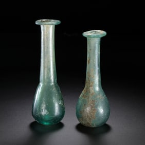 A pair of Chinese Tang Dynasty glazed long-necked vases