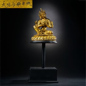 A Chinese gilt bronze statue of a seated Buddha from the Yongle period of the Ming Dynasty