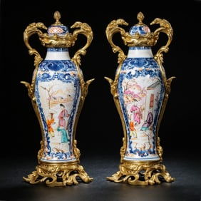 A pair of Chinese Qing dynasty gilt bronze enamel covered vases with figures and stories