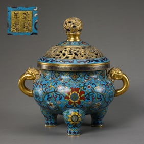A Chinese cloisonné enamel three-legged incense burner with two handles during the Qianlong period