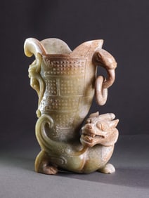 Chinese Han Dynasty jade cup with auspicious beasts and ring ears