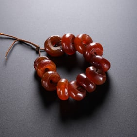 Agate grinding disc beads from the Hongshan culture of the Hongshan period in China