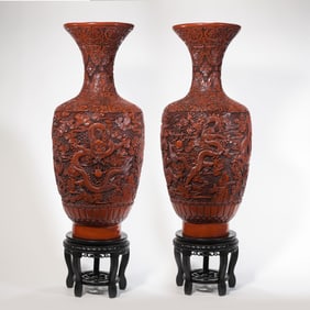 A pair of Chinese Qing Dynasty Qianlong period carved red dragon-patterned vases