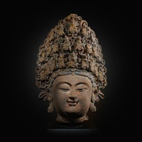 A Chinese Northern Wei Dynasty painted bluestone gilded Buddha head