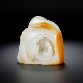 A Chinese Qing Dynasty Hetian white jade carving in the shape of a mountain