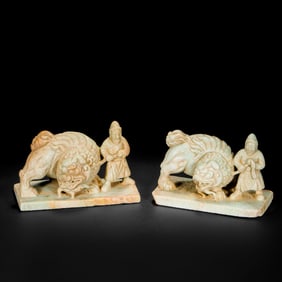 A pair of statues of foreigners leading lions from the Liao Dynasty in China