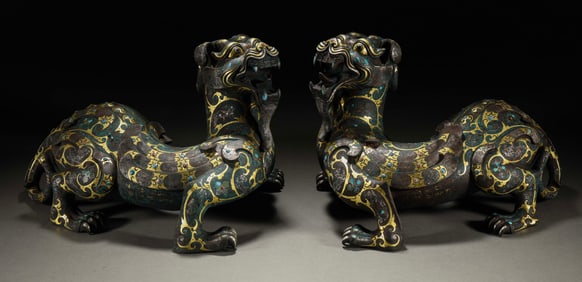 A pair of auspicious beasts inlaid with gold, silver and gemstones from the Warring States Period of
