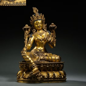 A Chinese gilt bronze statue of a seated Buddha from the Qianlong period of the Qing Dynasty