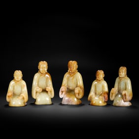 A Group of Seated Jade Figures from the Han Dynasty