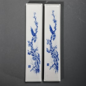 A pair of blue and white porcelain plate painting paperweights by Wang Bu, a 20th century Chinese