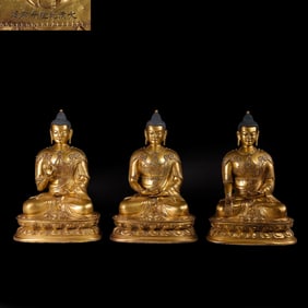 A group of Chinese bronze gilt statues of the Three Buddhas from the Qianlong period of the Qing