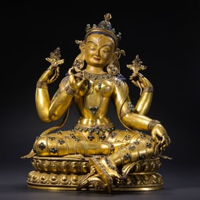 A Chinese Ming Dynasty Gilt Bronze and Turquoise Seated Buddha