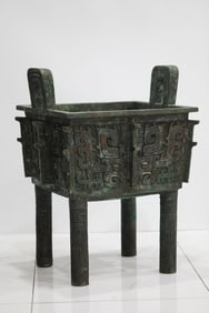 Chinese Shang and Zhou Dynasty bronze square tripod with animal faces