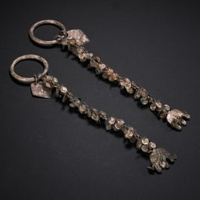 A pair of Korean silver ornaments from the Silla period