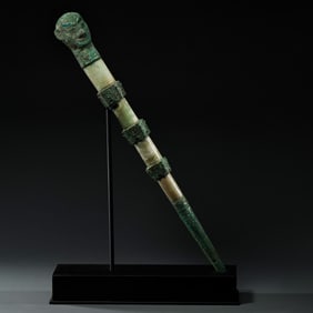 A bronze staff with a human head inlaid with jade and turquoise, China, Warring States Period