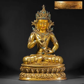 A Chinese Qing Dynasty Gilt Bronze and Turquoise Seated Buddha
