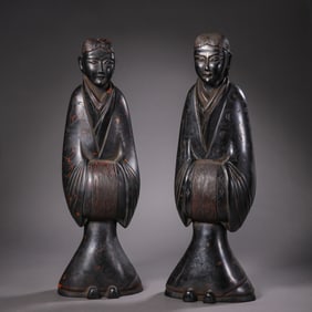 A pair of Chinese Han Dynasty painted wooden figures standing