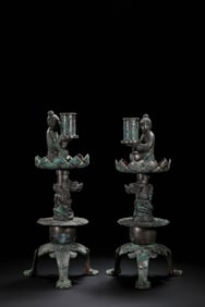 A pair of Chinese Han Dynasty human-shaped candlesticks