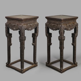 A pair of Chinese Qing Dynasty rosewood carved tables