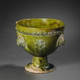 Chinese Sui Dynasty green glaze high-footed cup with drum-shaped nail pattern