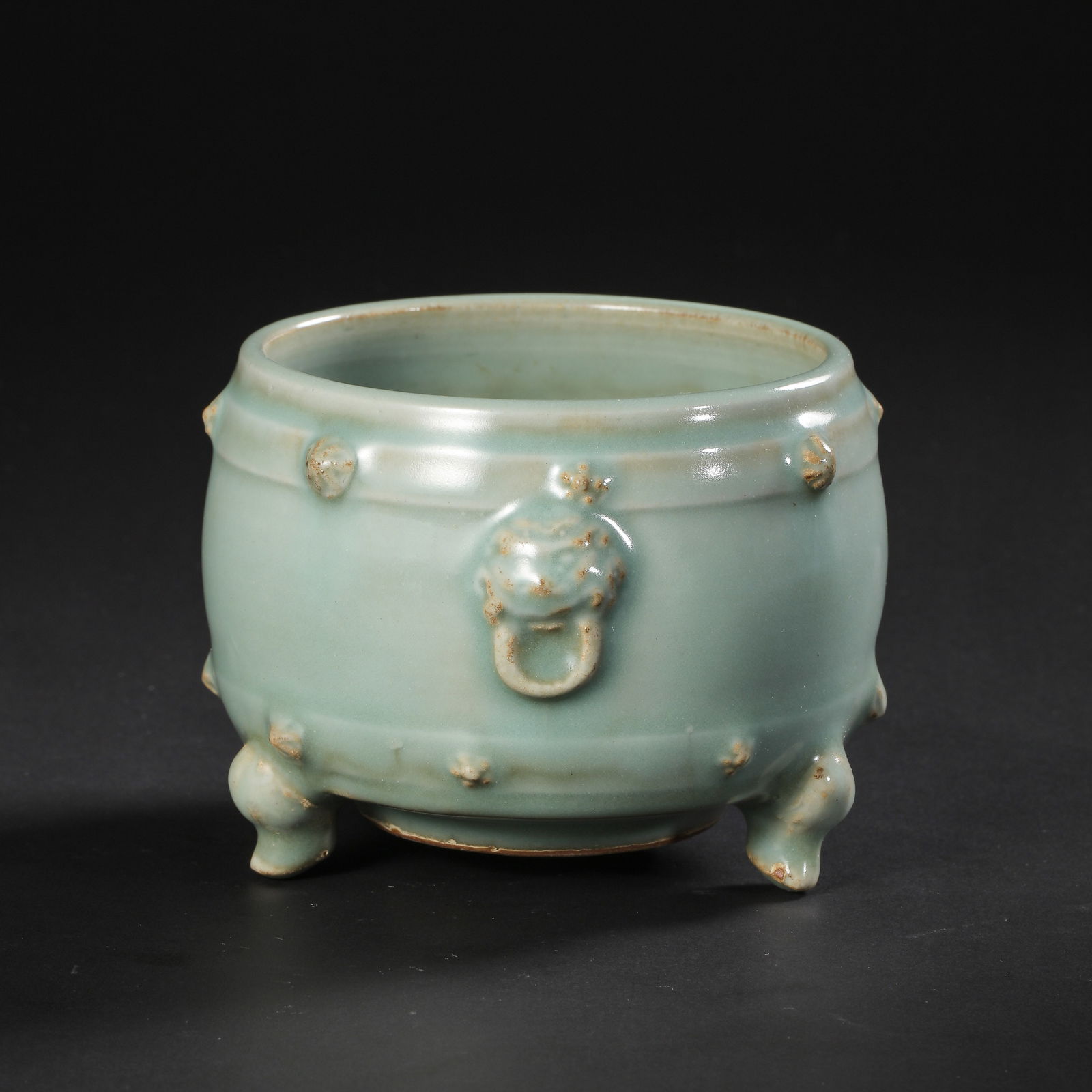 Chinese Southern Song Dynasty Longquan kiln green glaze drum nail pattern tripod censer: H. 8.4 cm. Diam. 12.5 cm.