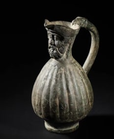 Achaemenid period, bronze pot with animal handle and figures