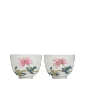 A pair of Chinese Qing Dynasty Yongzheng period famille rose floral cups